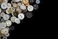 Sewing buttons background. White sewing buttons texture and patterns on black background Royalty Free Stock Photo