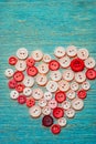 Sewing buttons in the shape of a heart Royalty Free Stock Photo