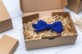 sewing craft business - packing blue fabric bow tie in box for shipping