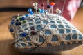 Sewing cushion with colored pins