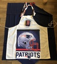 Sewing a decal on apron, Patriots, red sox