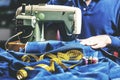 Sewing denim jeans with sewing machine. Repair jeans by sewing machine. Alteration jeans, hemming a pair of jeans, handmade