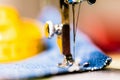 Sewing denim jeans with sewing machine. Repair jeans by sewing machine. Alteration jeans, hemming a pair of jeans, handmade