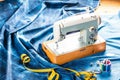 Sewing indigo denim jeans with sewing machine, garment industrial concept. Royalty Free Stock Photo