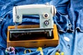 Sewing indigo denim jeans with sewing machine, garment industrial concept. Royalty Free Stock Photo