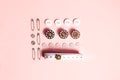 Sewing kit accessories and tools for needle work in pink. Tape measure, pins, scissors, buttons, prewound bobbins, thimble, thread