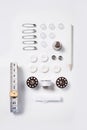 Sewing kit accessories and tools for needle work in white. Tape measure, pins, scissors, buttons, prewound bobbins, thimble,