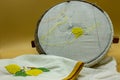 Sewing kit, needle, thread. On the frame is visible the canvas on which a lemon is being embroidered, at the end it will be like Royalty Free Stock Photo