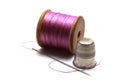 Sewing kit - Reel of cotton thread with a thimble and needle Royalty Free Stock Photo