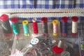Sewing kit, spools of thread scissors, thimble tailor buttons needles and pins Royalty Free Stock Photo