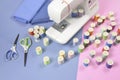 Sewing machine and colorful thread rolls for sewing on two tone Royalty Free Stock Photo