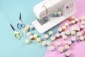 Sewing machine and colorful thread rolls for sewing on two tone Royalty Free Stock Photo
