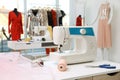 Sewing machine and equipment on table in dressmaking workshop Royalty Free Stock Photo