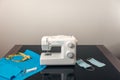 Sewing machine, fabric, elastics to make homemade surgical masks during confinement in the covid-19 coronavirus crisis Royalty Free Stock Photo