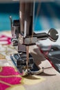 Sewing machine foot in close up. Selective focus on the tip of the needle Royalty Free Stock Photo