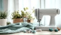 Sewing machine, green fabric and craft accessories on wooden table on light background Royalty Free Stock Photo