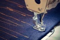 Sewing machine and item of blue clothing Royalty Free Stock Photo