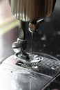 The sewing machine and item of clothing, Detail of sewing machine and sewing accessories, old sewing machine Royalty Free Stock Photo