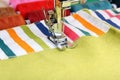 Sewing machine and item of clothing material Royalty Free Stock Photo