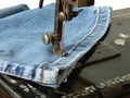 Sewing machine and jeans Royalty Free Stock Photo