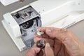 Sewing machine maintenance. Royalty Free Stock Photo