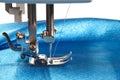 Sewing machine makes a seams on fabric, side view Royalty Free Stock Photo