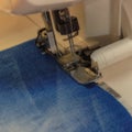 Sewing machine repair jeans trousers, close-up