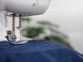 sewing machine sew seam of blue denim jean Royalty Free Stock Photo