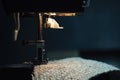 A Sewing Machine Sews Burlap Fabric. Sewing Hemp Fabric Clothing. Close-Up Macro Shot. Sewing Still Life Royalty Free Stock Photo