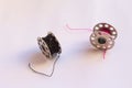 sewing machine steel yarn, bobbin for thread on white background