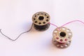 sewing machine steel yarn, bobbin for thread on white background Royalty Free Stock Photo