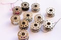 sewing machine steel yarn, bobbin for thread on white background Royalty Free Stock Photo