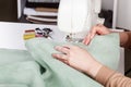 Sewing machine, stitching fabrics, needle in a round plan