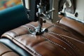 sewing machine stitching leather for furniture upholstery Royalty Free Stock Photo