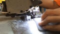 Sewing machine stitching on textile
