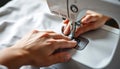 Sewing Machine in Use, Hands Guiding Fabric for Sewing Project Royalty Free Stock Photo