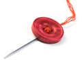 Sewing needle with button Royalty Free Stock Photo