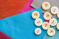 Sewing, patchwork, tailoring and fashion concept - closeup on set of white buttons for needlework on a background of