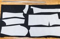 Sewing patterns of dress on wooden table Royalty Free Stock Photo