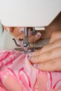 Sewing pink on a machine