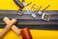 Sewing process of the leather belt. Tools, materials and accessories for leather workshop. Vintage sewing industrial Royalty Free Stock Photo