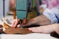 Sewing process on the old seawing mashine. Selective focus. Royalty Free Stock Photo