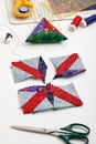 Sewing process of patchwork block, pincushion, quilting and sewing accessories Royalty Free Stock Photo