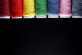 Sewing Quilting Thread, Rainbow colors. on black background with place for your own text