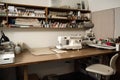 sewing room with sewing machine, fabric, and tools organized on worktable