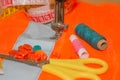 Sewing still life: colorful cloth. scissors and sewing kit includes threads of different colors, thimble and other sewing Royalty Free Stock Photo