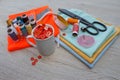 Sewing still life: colorful cloth. scissors and sewing kit includes threads of different colors, thimble and other sewing accessor Royalty Free Stock Photo