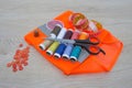 Sewing still life: colorful cloth. scissors and sewing kit includes threads of different colors, thimble and other sewing accessor Royalty Free Stock Photo