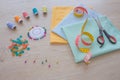 Sewing still life: colorful cloth. Sewing kit includes threads of different colors, thimble and other sewing accessories on table Royalty Free Stock Photo