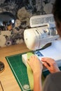 Sewing, stitching and overlocking on a machine at home Royalty Free Stock Photo